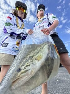 Boerne Bass Club angler at weigh-in with sponsor banners, Boerne Texas youth bass fishing